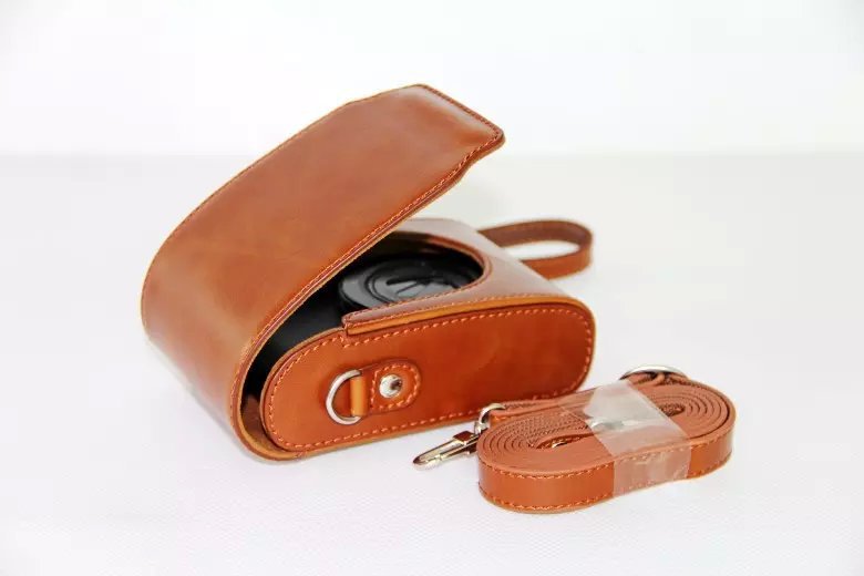 Universal PU Leather Camera Protective Pouch + Strap for Leica / Panasonic / Fuji / Canon, Size: 11x6.5x3.5cm  - Brown