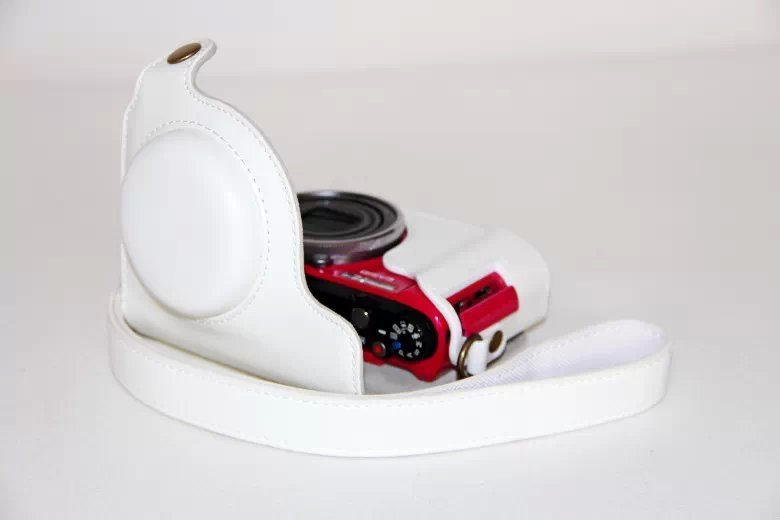 Protective Leather Camera Cover Casing with Shoulder Strap for Casio ZR1000/1200/1100/1500 - White