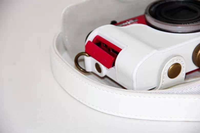 Protective Leather Camera Cover Casing with Shoulder Strap for Casio ZR1000/1200/1100/1500 - White