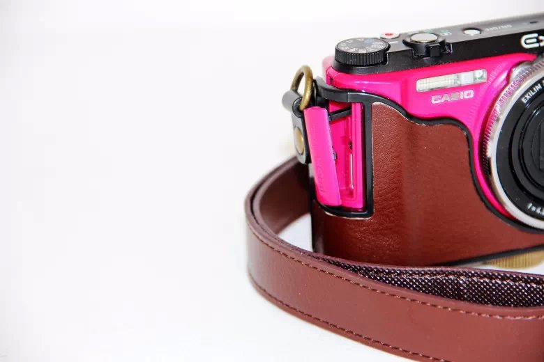 Protective PU Leather Camera Cover Casing with Shoulder Strap for Casio ZR1000/1200/1100/1500 - Coffee