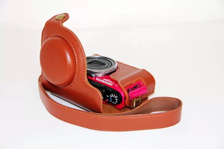 Protective PU Leather Camera Cover Casing + Shoulder Strap for Casio ZR1000/1200/1100/1500 - Brown
