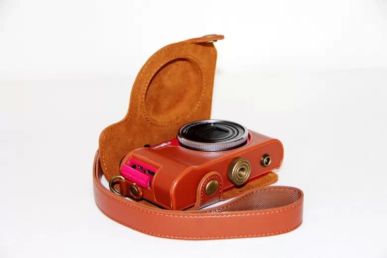 Protective PU Leather Camera Cover Casing + Shoulder Strap for Casio ZR1000/1200/1100/1500 - Brown